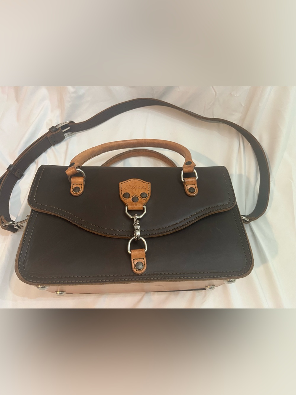 Saddleback Leather two-toned satchel purse with handles and crossbody strap